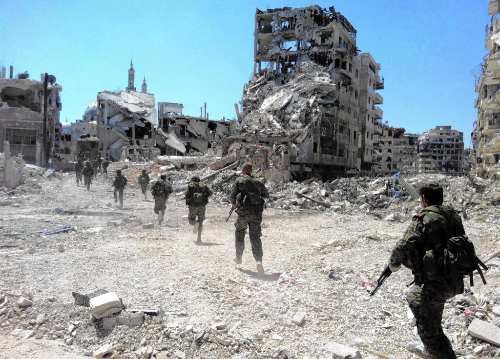 la-afp-getty-syria-conflict-anniversary-files3-j-20140327