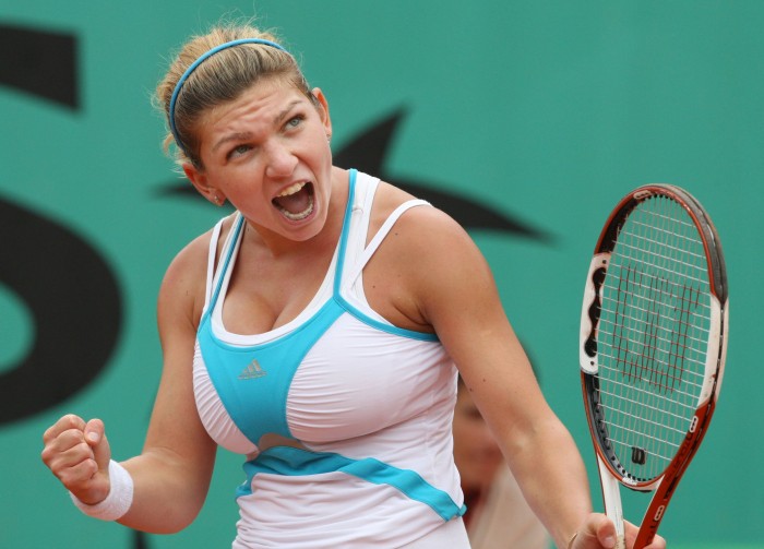 Romanian Simona Halep celebrates after winning a point against compatriot Elena Bogdan during their French tennis Open final match in the category junior at Roland Garros on June 08, 2008 in Paris. Halep won 6-4, 6-2. AFP PHOTO / Pierre Verdy